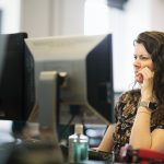 Woman in front of PC screen