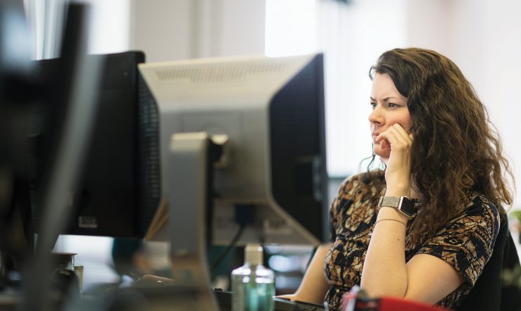 Woman in front of PC screen