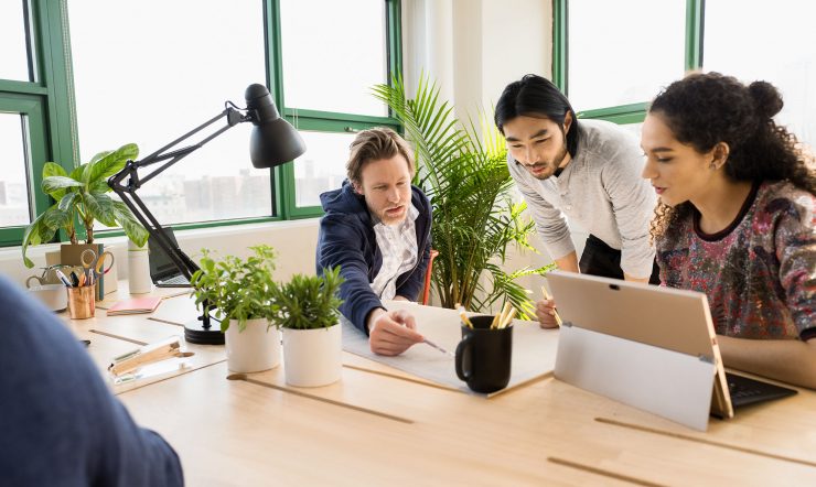 Small business team collaborating in modern workplace.