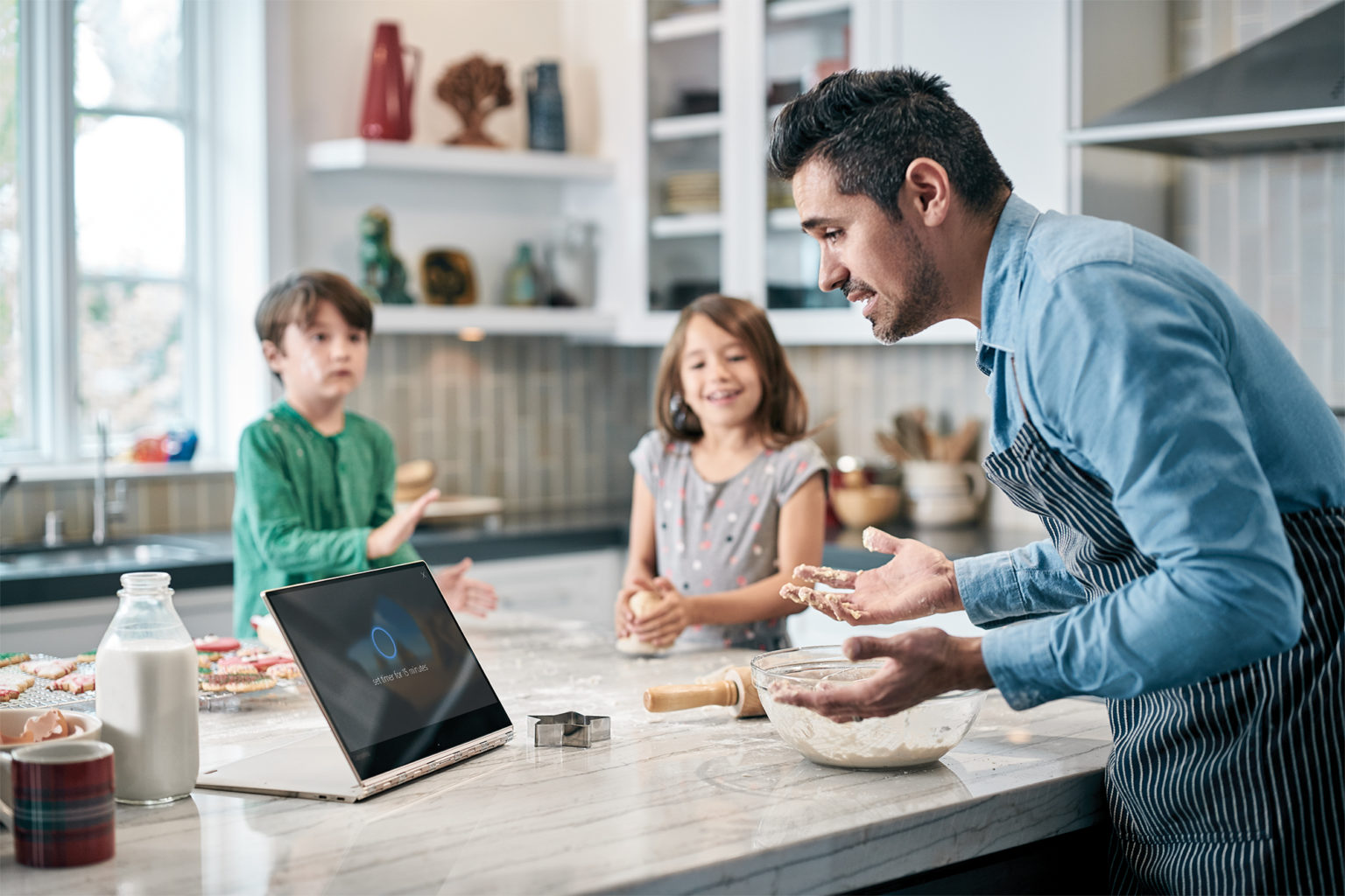 Image of Dad Baking with Kids and Device