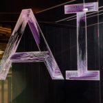 AI spelled in neon letters