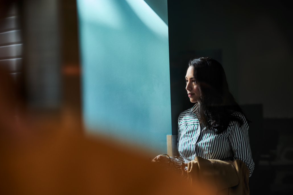 a person standing in front of a mirror posing for the camera