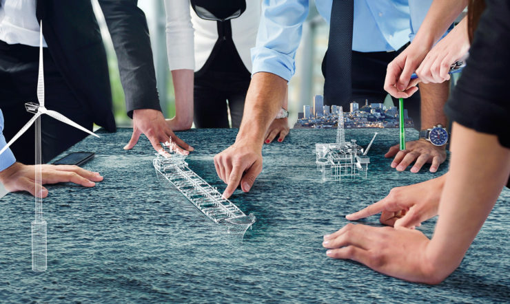 a group of people using a virtual map of a sea