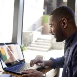 a man using a laptop computer