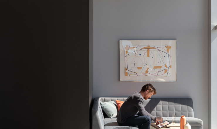 Contextual image of man inside working on Surface Pro X inking with Surface Pen on screen