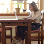 a person sitting on a chair in a room