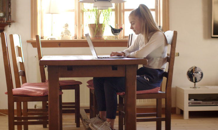 a person sitting on a chair in a room