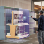 Two men standing in front of a digital stand in a store with HoloLens. One is interacting with it