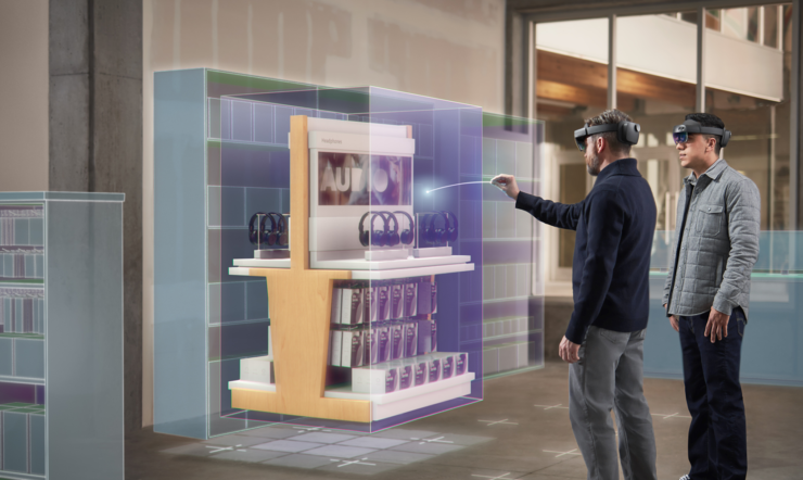 Två män står framför ett digitalt ställ i en butik med HoloLens. En interagerar med det