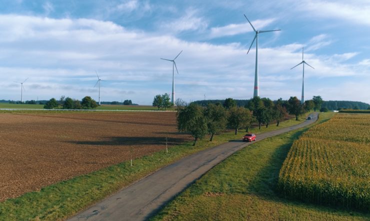 a dirt road in a grassy field