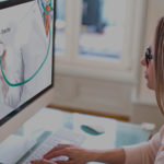 a woman standing in front of a screen