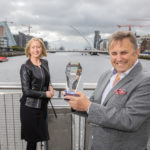 Aisling Curtis, John Purdy standing next to a dock