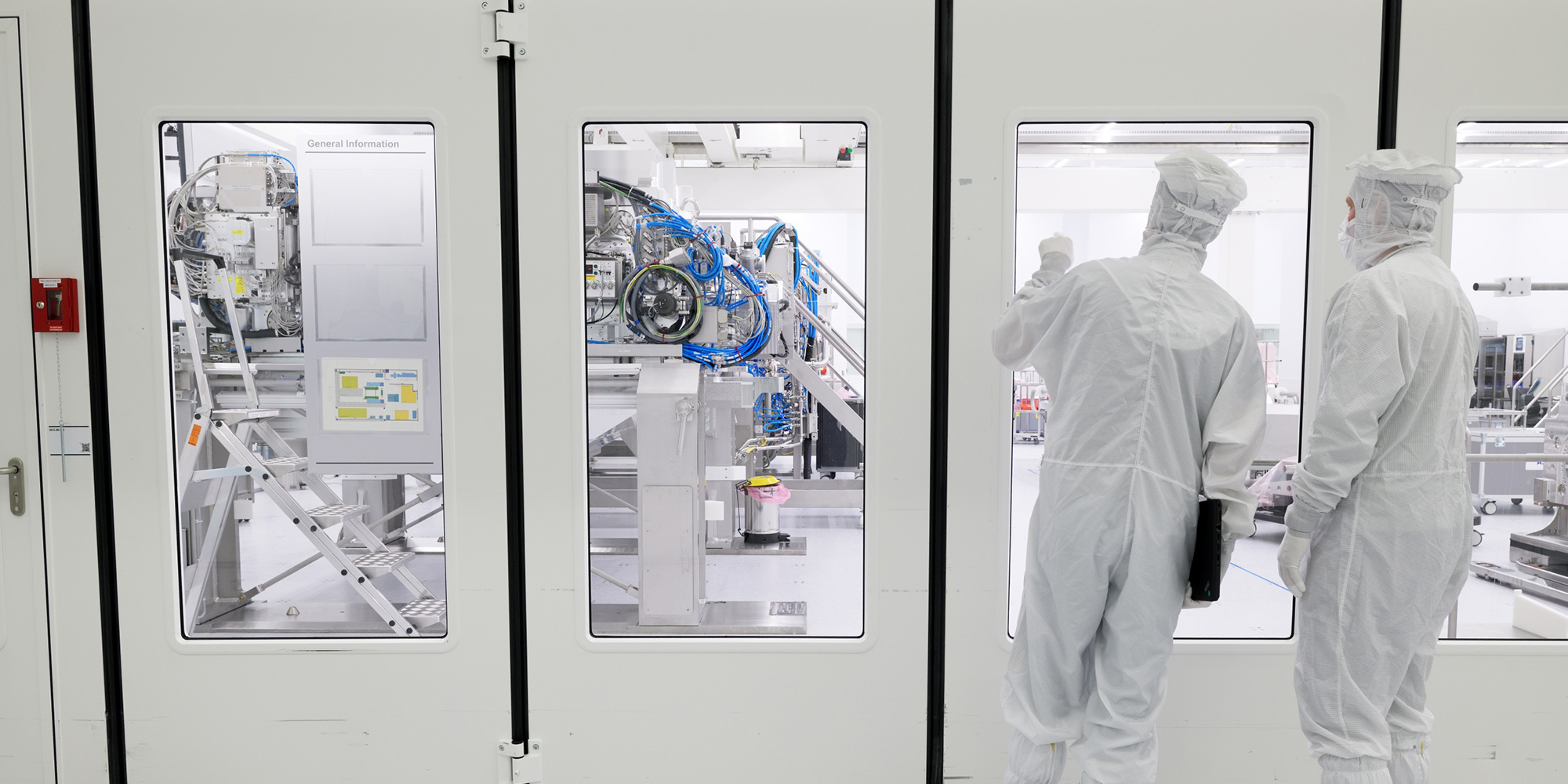Two Engineers preparing to service a clean room