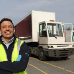 a person standing in front of a truck