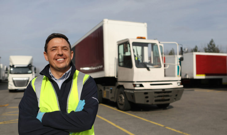 a person standing in front of a truck