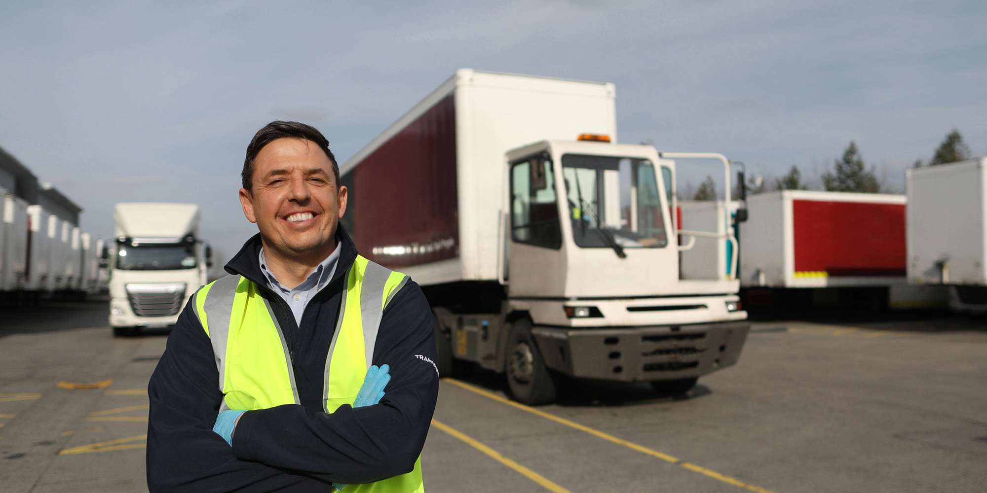 A man standing in front of a truck