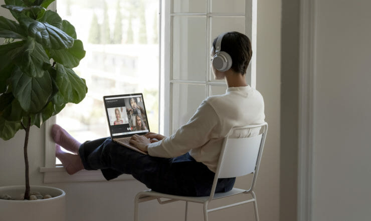 a person sitting in front of a window