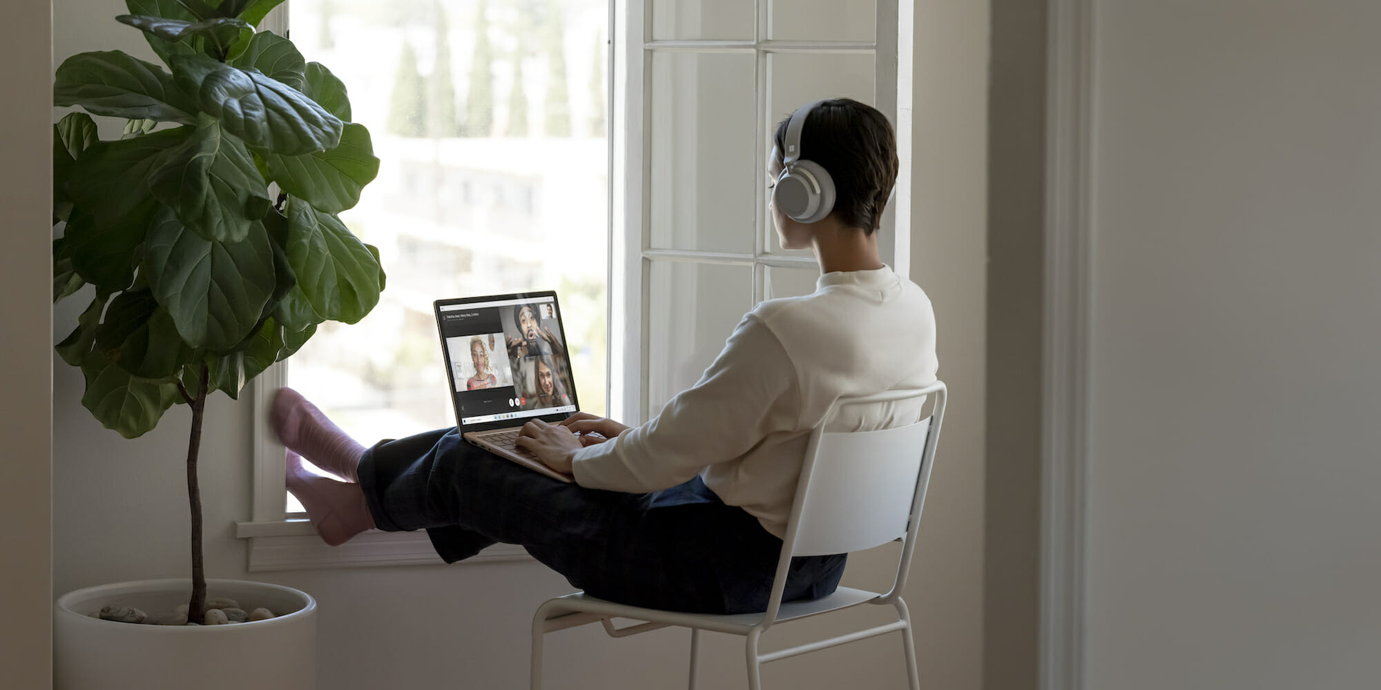 a person sitting in front of a window