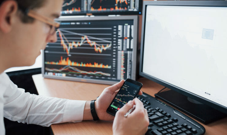 a young boy using a laptop computer