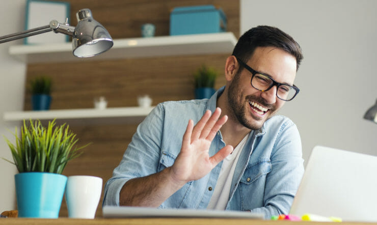 a man in glasses looking at the camera
