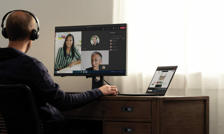 a person standing in front of a computer