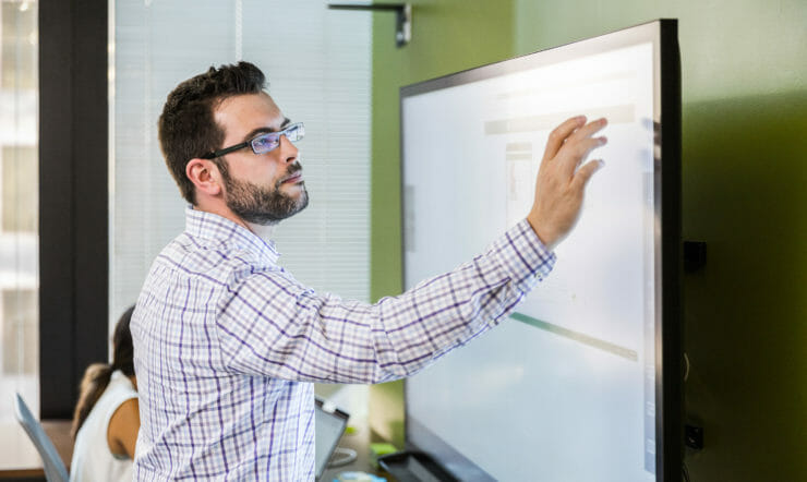 a man standing in front of a window