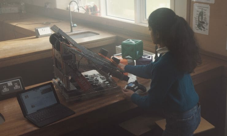 a person sitting at a desk in front of a computer