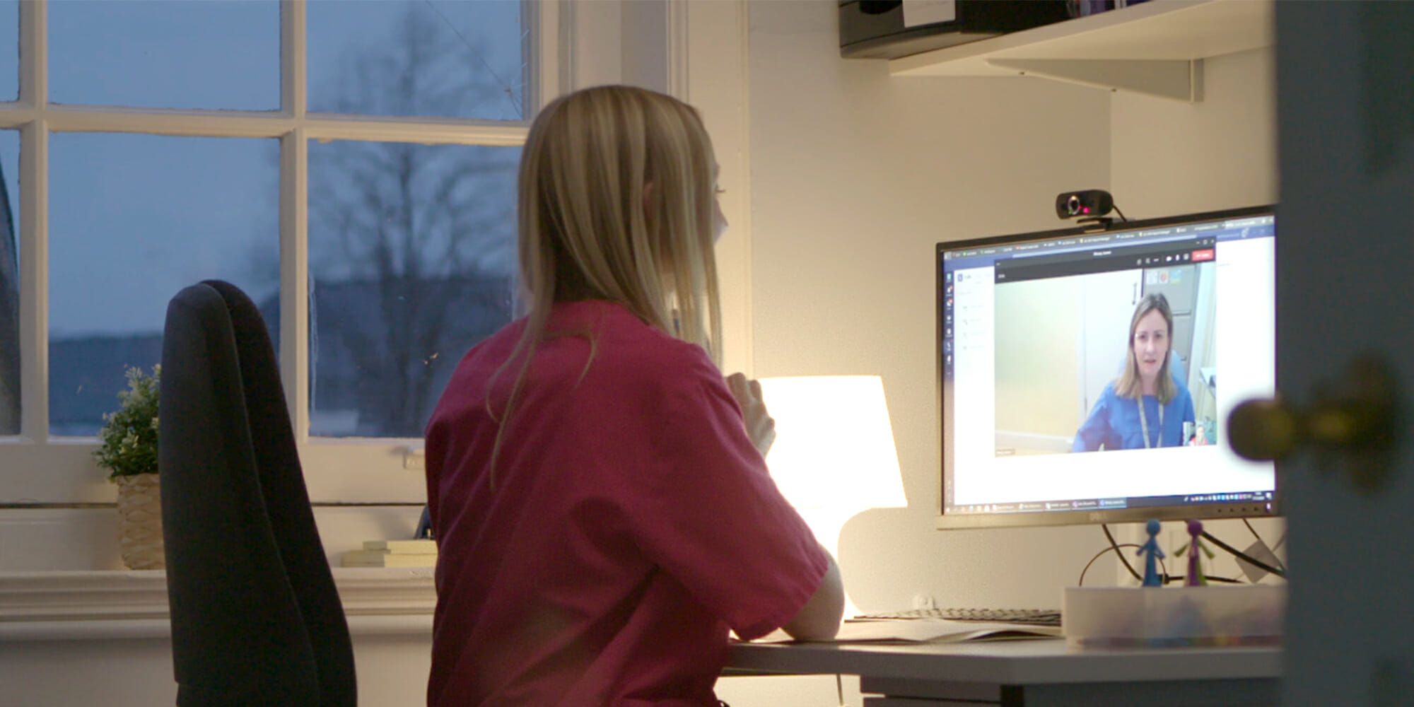 Two female nurses having a virtual conversation through Microsoft Teams