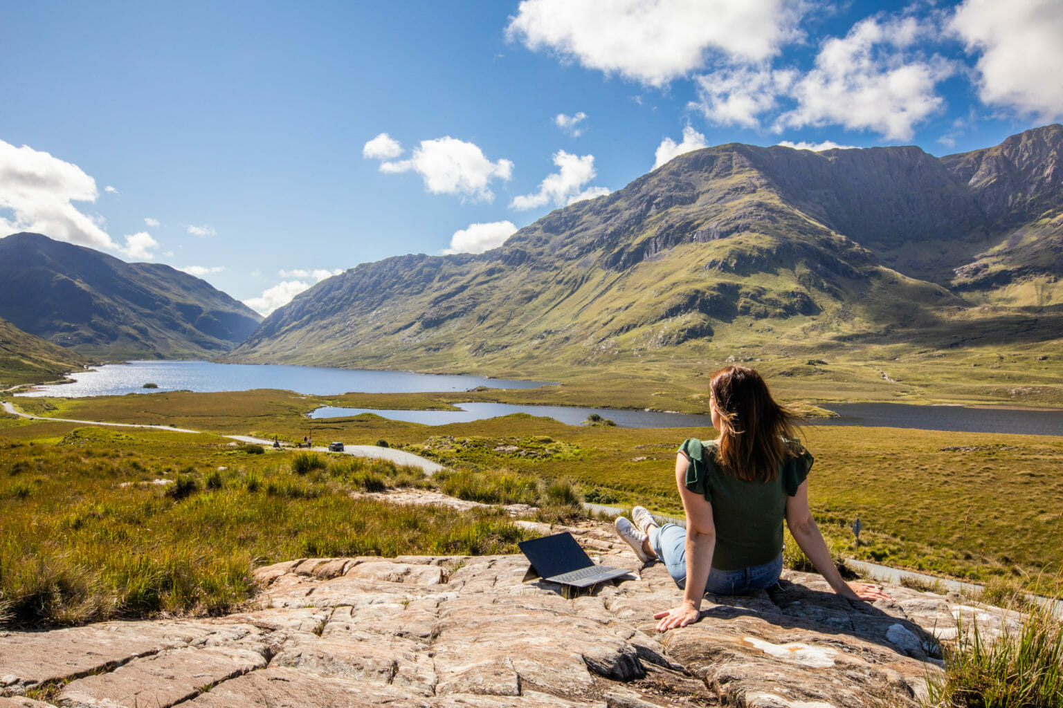 a person standing in front of a mountain