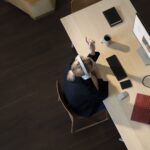 Woman on desk, Surface Devices infront of her