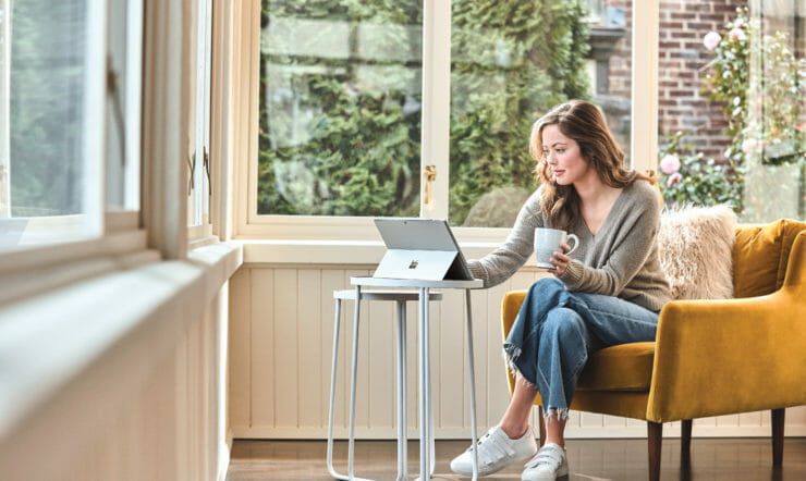 Woman sitting in chair inside