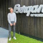 Espen infront of a Bergans sign