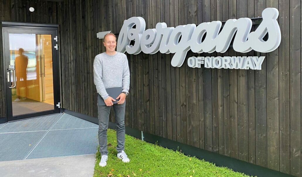 Espen infront of a Bergans sign