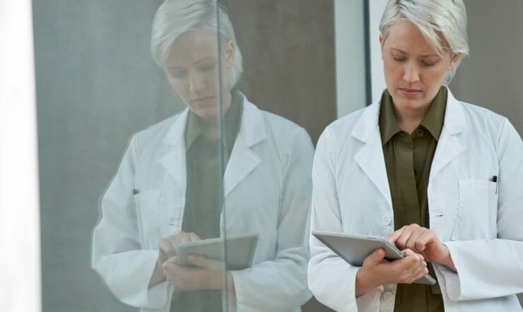 doctor holding surface laptop