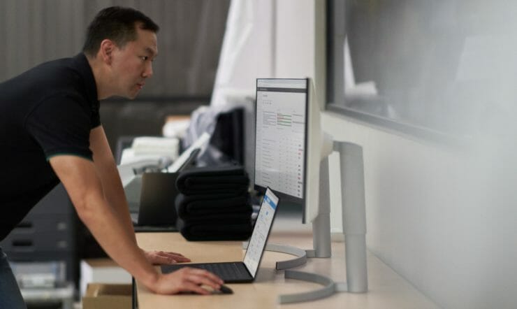 man working behind desk