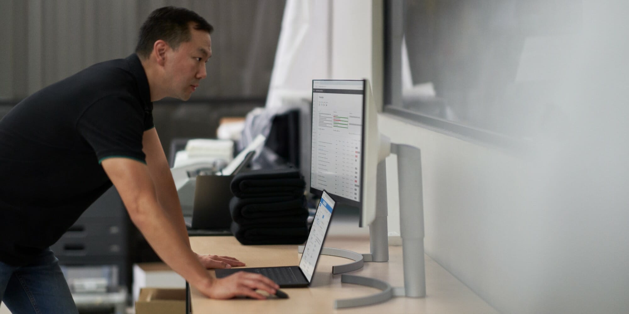 man working behind desk