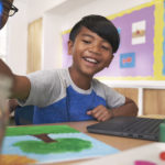 Student smiling in the classroom