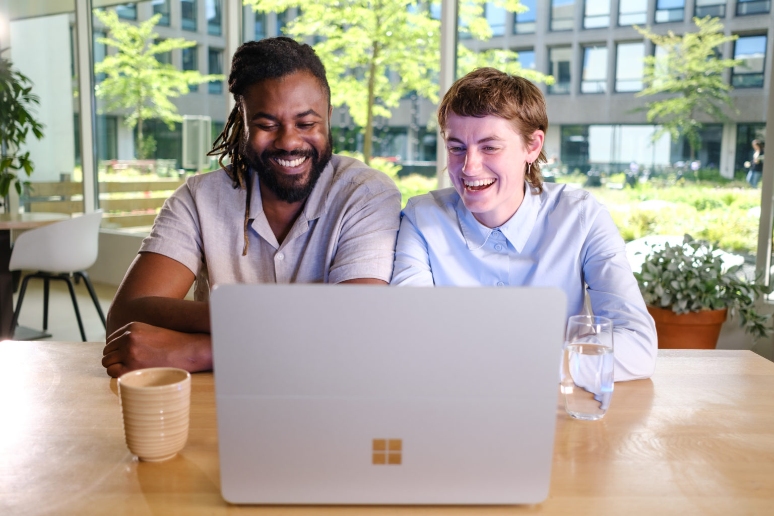 Two people with Surface Laptop Studio