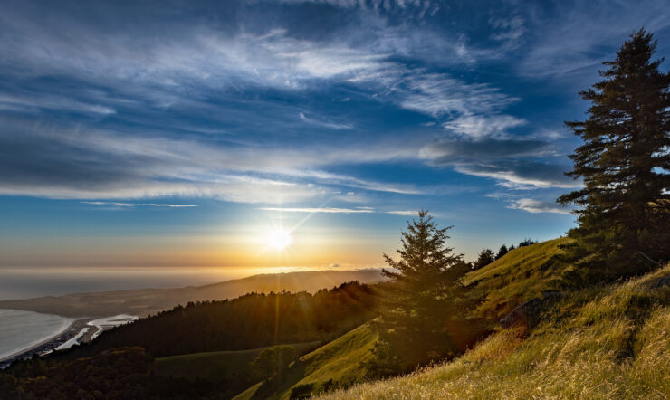Expansive view of ocean coast at sunset across the foothills in Mount Tamalpais State Park, Mill Valley, California