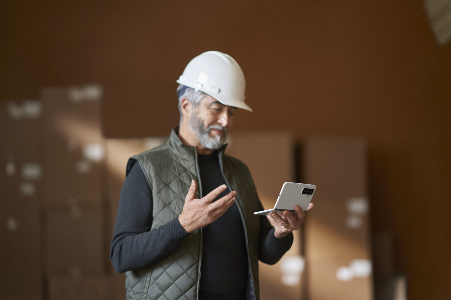 Surface in manufacturing, man with Surface Duo