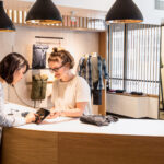 Shopkeeper tending a customer in a clothing store