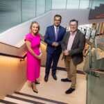 Image of three people on a stairs