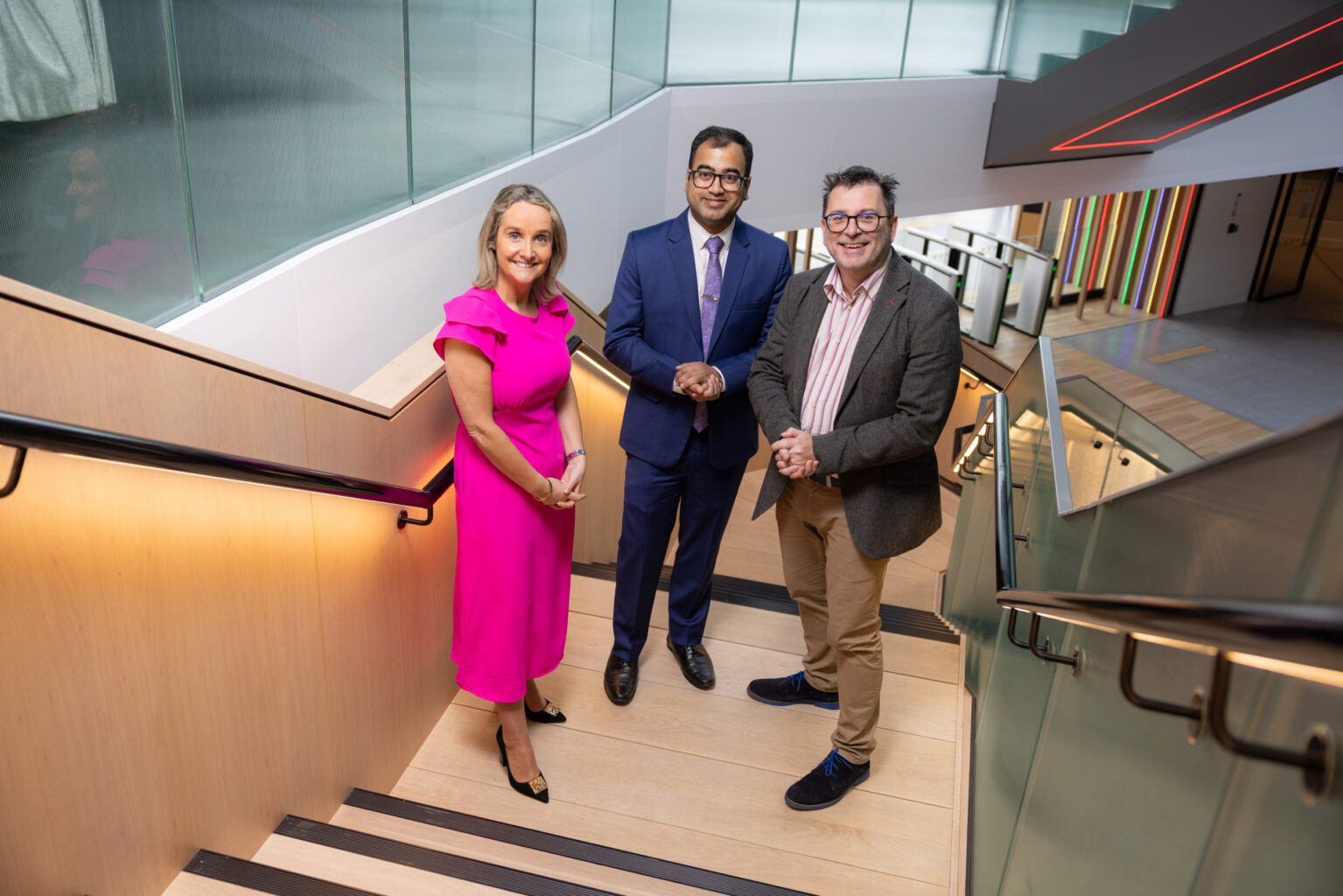 Image of three people on a stairs