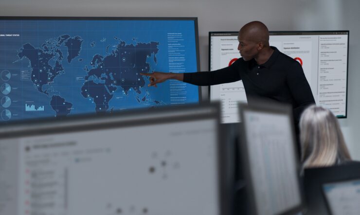 CISO (chief information security officer) collaborating in a security operations center.