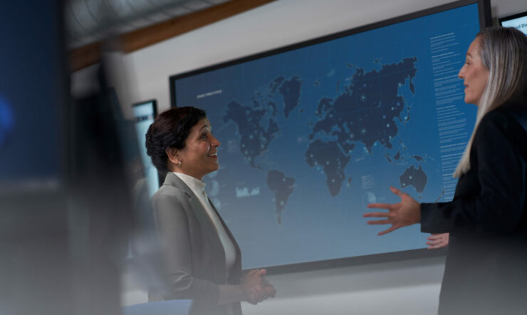 Image of two people speaking to each other